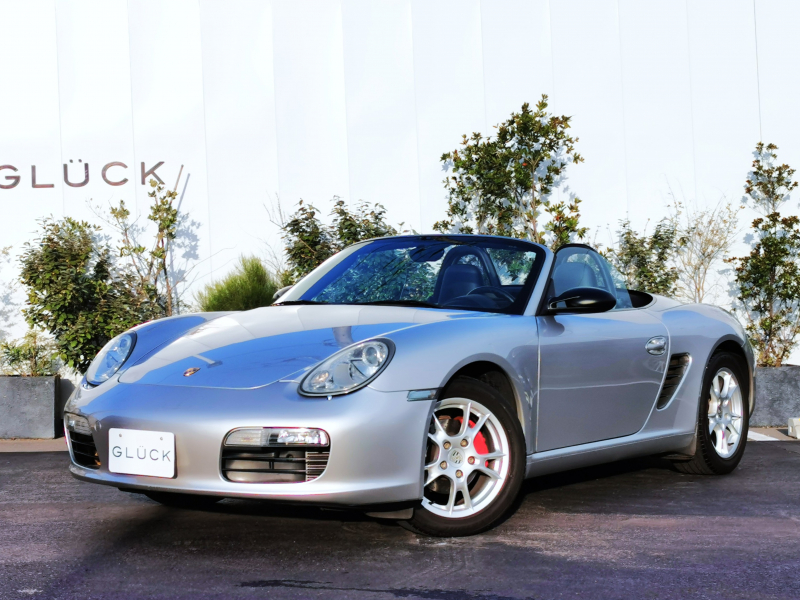 ポルシェ ボクスター(Type987) ティプトロニックS　左ハンドル 社外ナビ バックカメラ ハーフレザー シートヒーター ウィンドウディフレクター ETC 17インチボクスターⅡAW 2Way電動シート オートエアコンディショナー ブラック電動ソフトトップ